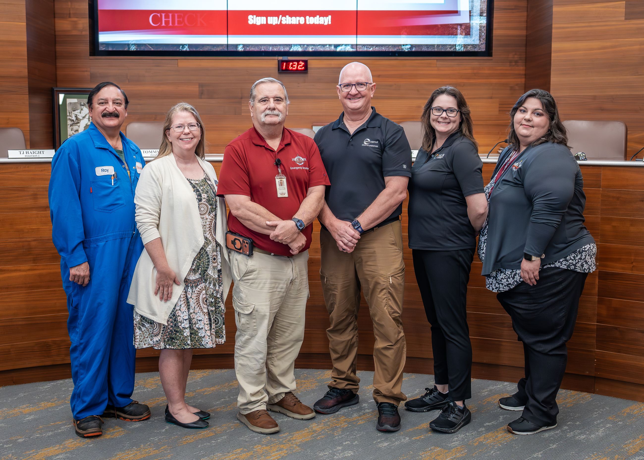 Several men and women standing in a line