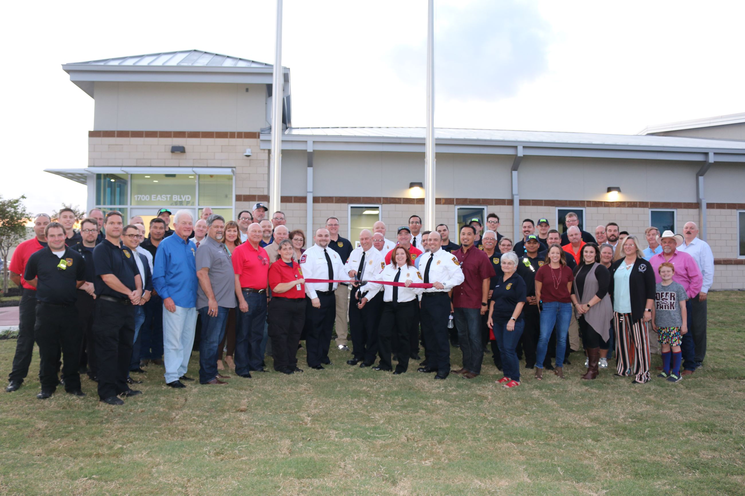 Large group of people in front of the EMS station for grand opening.